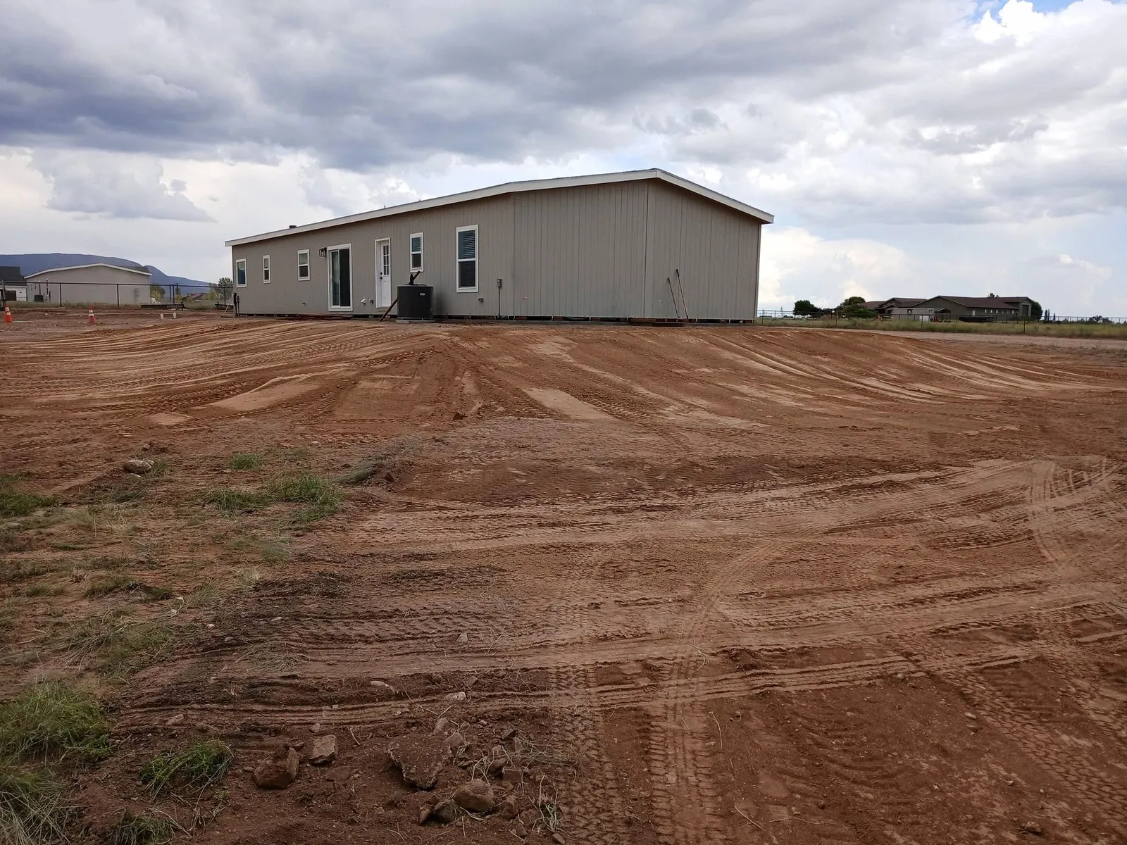 A finished graded pad around a home on an Arizona lot